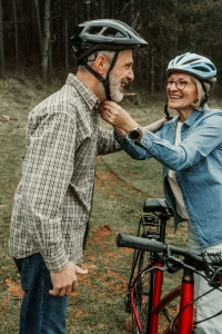 senior couple biking after endovascular surgery and a balloon angioplasty stent procedure